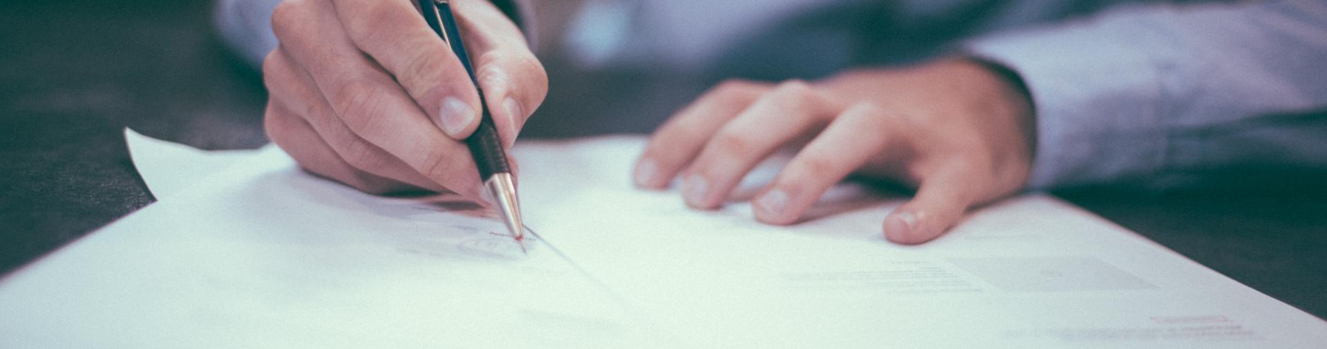 Man signing document