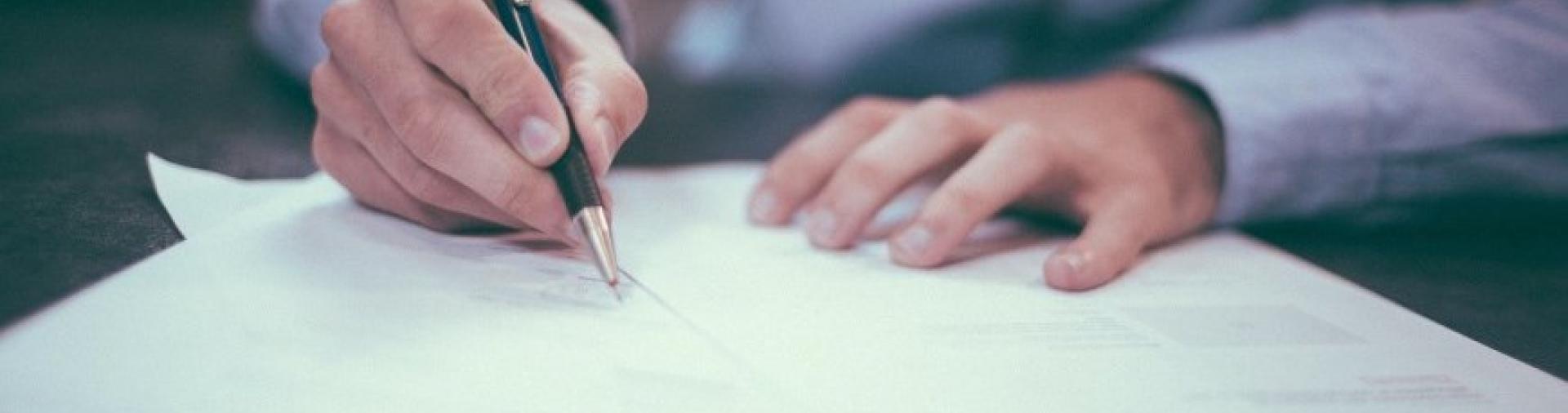 A person signing a document