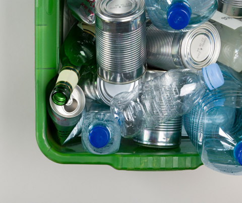 Recycling box containing cans and bottles.